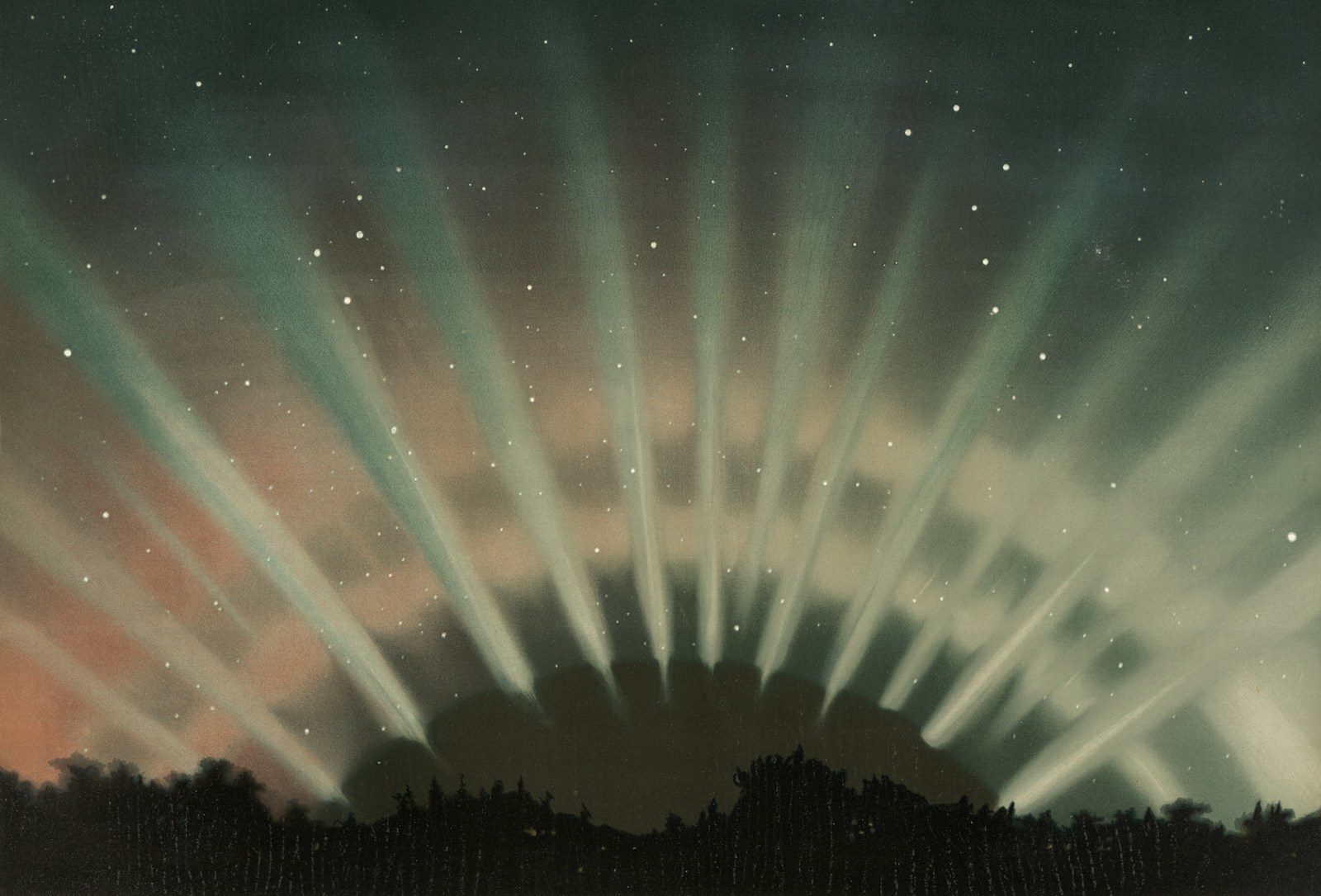 Spotlights shine through clouds at dusk over trees
